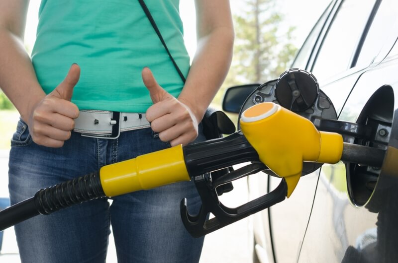 Women fueling her car