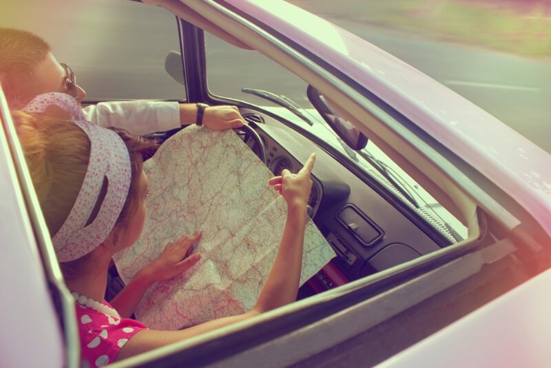 Couple planning their route to get better fuel economy
