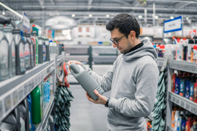 Man buying new engine oil