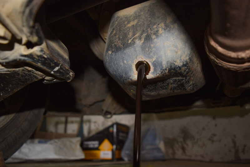 Draining old engine oil