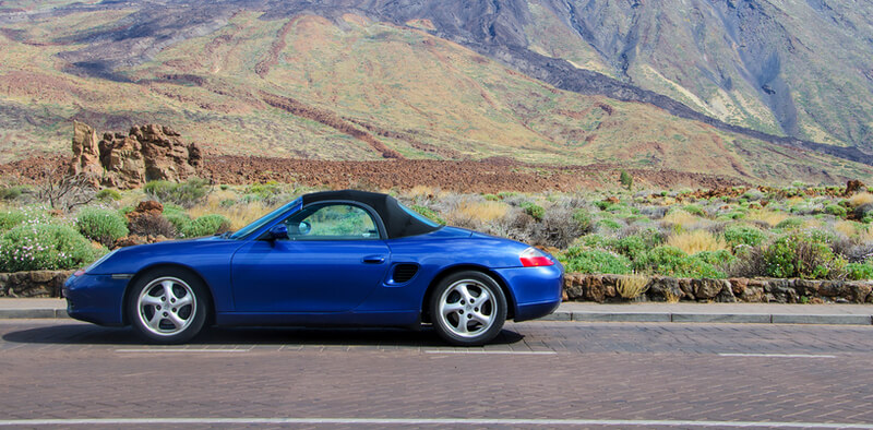 Sideview of a blue Porsche Boxster 986