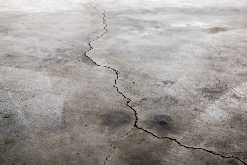 Dirty and cracked garage floor