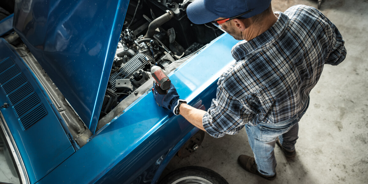 Man Doing High-Value DIY Car Maintenance Tasks